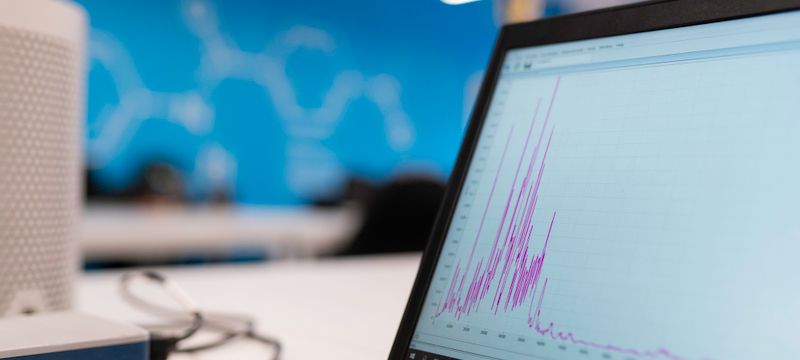 Laptop screen showing business growth analytics graph